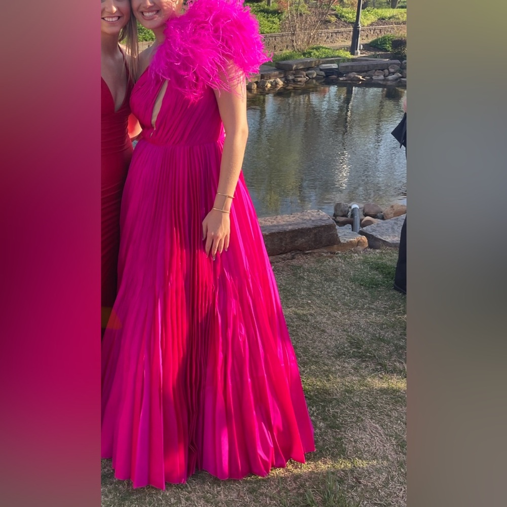 Tarik Ediz Fuchsia ballgown with one shoulder feathers
